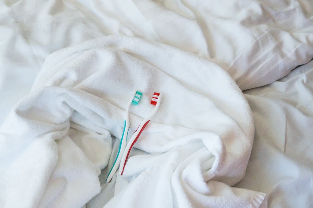 Toothbrushes on Omena Hotels bed
